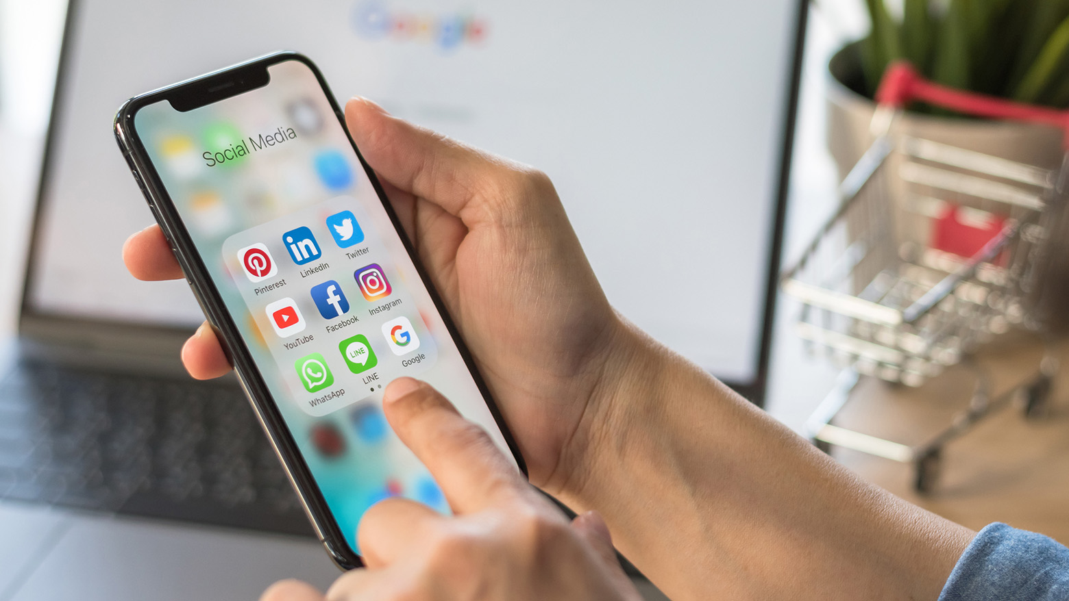 Someone uses an iPhone to look at their social media apps