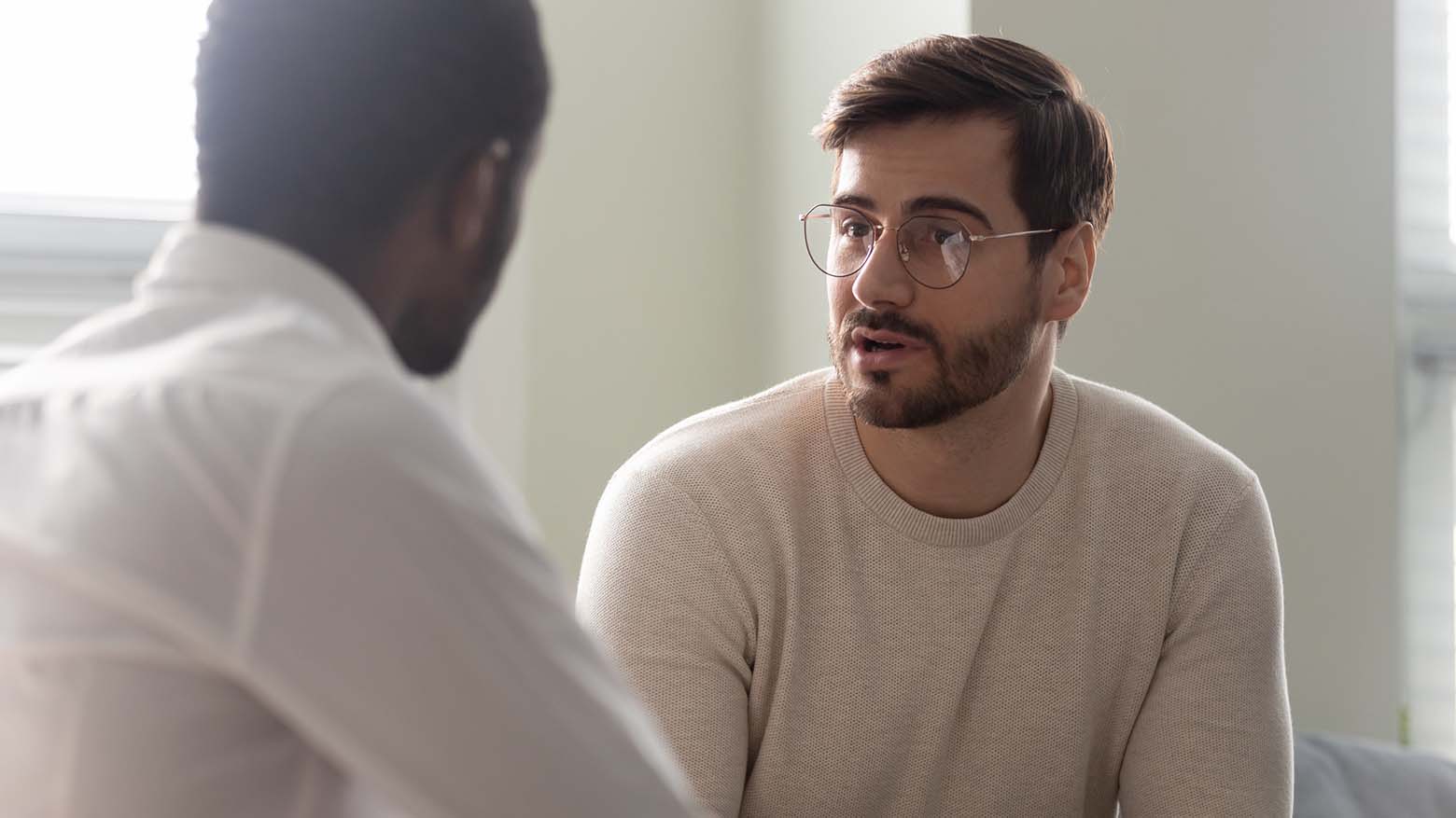A man speaks to a psychologist