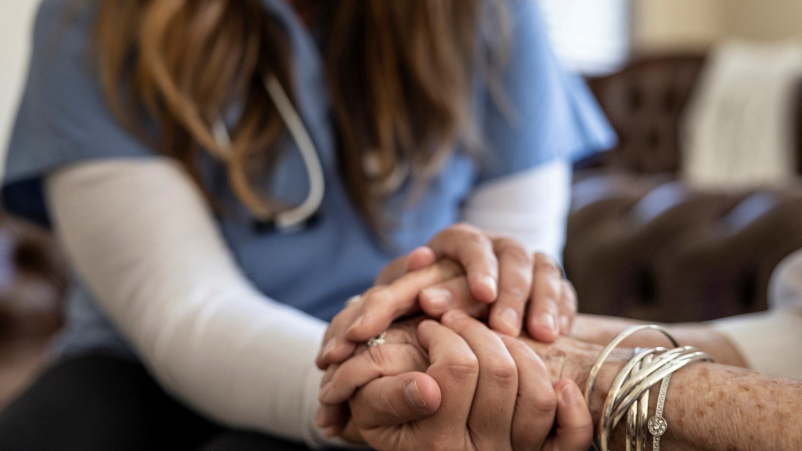 doctor holding patient's hands